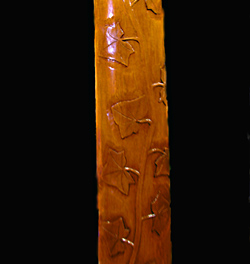 Wood carving of ivy climbing a four poster bed